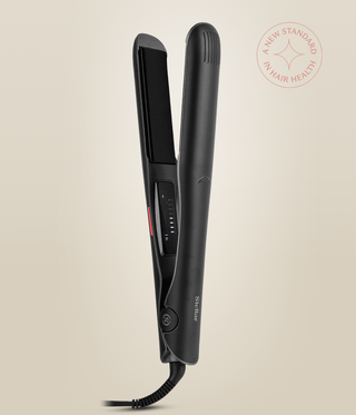 Astral Black Omnia Styler Plus upright and open, with its plate and temperature controls visible.